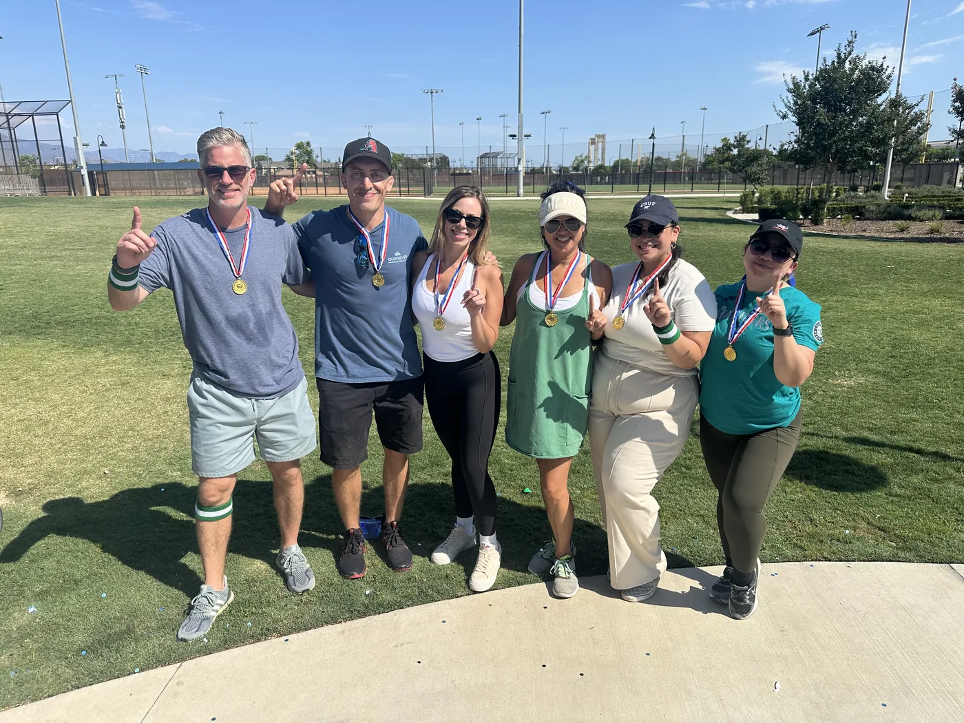 PacificWest team members gathering outside at a company outing